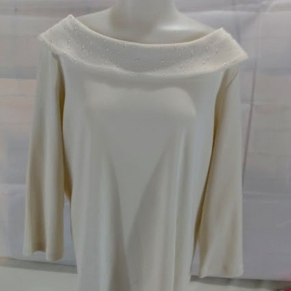 Rafaella Studio: Cream colored sweater with cowl neck.